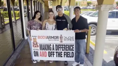 Student athletes from Florida, Illinois hand out thank-you cards with $100 to workers in Hialeah