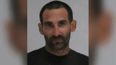 Man beheaded in machete attack at motel, witness says; suspect in police custody